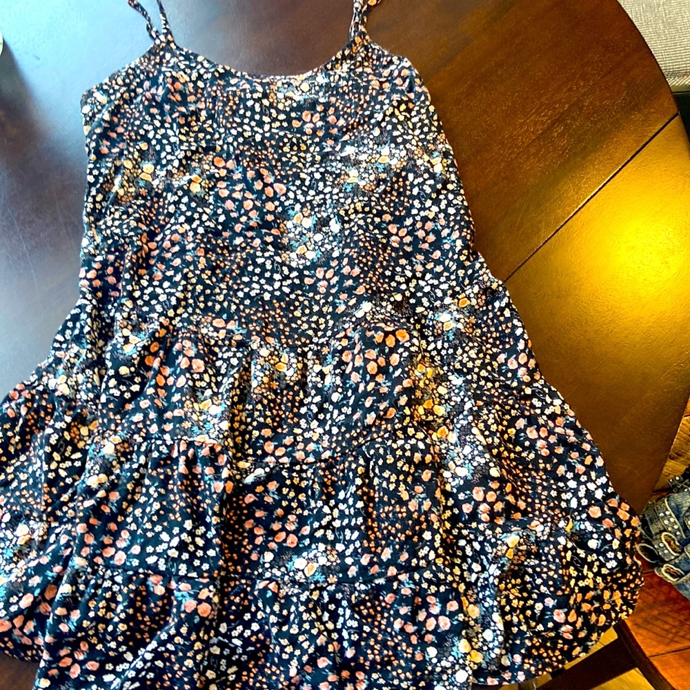 Flower dress with spaghetti straps and and ruffled bottom
